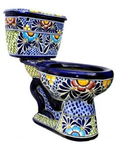 an artisticly designed toilet bowl is shown