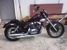 a motorcycle parked in front of a garage door