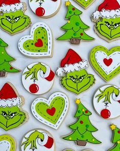 the grin face cookies are decorated with green and red decorations