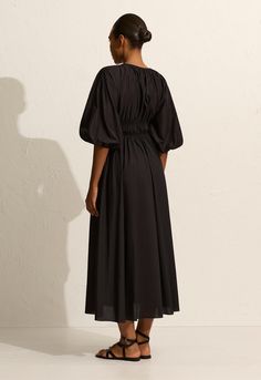 A comfortable and flattering midi style dress, featuring three-quarter length voluminous sleeves with elasticated hem, a deep V neckline featuring a single button and loop closure and inseam pockets at the hip to create ease and comfort. Perfectly paired with a strappy sandal for a summer's day. Voluminous Sleeves, Midi Dress Style, Knit Sweatshirt, Button Dress, V Neckline, Short Shirts, New Arrival Dress, Style Dress, Knitted Pullover