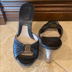 Ferragamo Wooden Clogs; Black With Pale Gold Hardware And Wooden Heel; Great Condition; Gently Used Elegant Platform Clogs With Open Heel, Elegant Open Heel Platform Clogs, Designer Leather Clogs With Wooden Heel, Formal Clogs With Removable Insole And Almond Toe, Elegant Leather Clogs With Heel Strap, Elegant Slip-on Mules With Wooden Heel, Formal Leather Clogs With Open Heel, Elegant Spring Clogs With Branded Insole, Elegant Platform Closed Toe Clogs