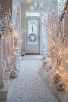 a hallway decorated with white christmas decorations and lights