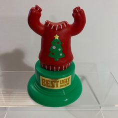 a plastic toy with a christmas tree on top