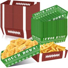 three boxes filled with chicken and french fries sitting next to each other on top of a white surface