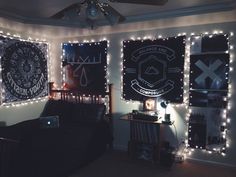 a bedroom decorated with lights and pictures on the wall