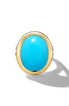 A split shank features signature engraving in this two-tone ring centered by a piercing cabochon. Total reconstituted turquoise weight: 10.65ct. Reconstituted turquoise or black onyx/sterling silver/18k gold Imported Luxury Turquoise Oval Cabochon Ring, Turquoise Oval Cabochon Ring With Polished Finish, Oval Turquoise Ring With Polished Finish, Oval Ring, Oval Rings, Split Shank, David Yurman, Black Onyx, Onyx