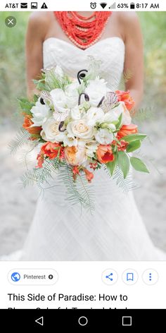 the bride is holding her wedding bouquet