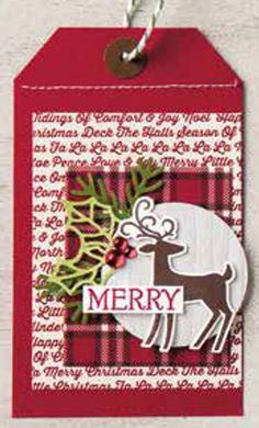 a christmas tag with a reindeer and holly on it, hanging from a string that says merry