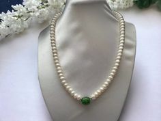 Freshwater Pearl with Green Jade Barrel design Necklace  Material : Freshwater Pearl, jade & silver plated clasp Pearl shape: button shape Pearl Size: 8-9mm Jade shape : 13mm x10mm  Clasp : good luck symbol silver plated clasp Necklace Length : 16",18 " & 20" Packing: silk Bag Elegant Green Jade Pearl Necklace, Green Pearl Necklace For Formal Occasions, Formal Green Pearl Necklace With Round Beads, Elegant Jade Pearl Necklace For Gift, Green Round Pearl Necklace For Gift, Jade Design, Luck Symbol, Good Luck Symbols, Silk Bag