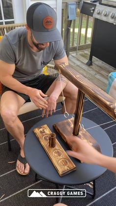 a man sitting on top of a chair next to another person