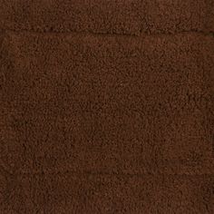 a brown area rug that is very soft