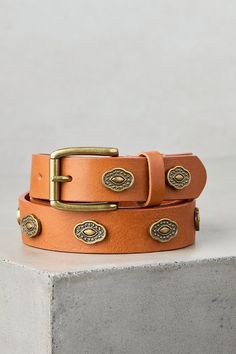 Exuding rustic charm and timeless adventure, the Balaton western leather belt is a testament to unparalleled artisanship. While artisan crafted of durable leather cowhide in earthy tones, Balatan maintains an understated spark of interest, from its antiqued metal medallions on its strap to its sturdy, eye-catching metal buckle. Rustic Leather Belt With Antique Buckle, Adjustable Rustic Leather Belt Buckles, Adjustable Artisan Leather Belt Buckles, Rugged Brown Belt With Brass Buckle, Adjustable Rustic Leather Belt, Rustic Adjustable Leather Belt, Artisan Brown Belt With Concho, Brown Artisan Belt With Antique Buckle, Artisan Brown Belt With Antique Buckle