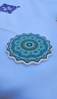 a blue table cloth with an intricate design on it