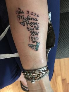 a woman with a tattoo on her arm that says melina rose and has musical notes all over it