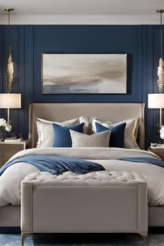 a bedroom with blue walls, white bedding and an upholstered bench in front of the bed