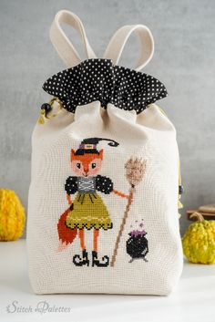 A witchful cross stitch project for that ghostly time of year, this pattern is meant to add a bit of friskiness to your Halloween decor. It’s a really cute pattern to stitch onto trick-or-treat bags, candy pouches, or even spooky costumes! Character Cross Stitch, Cunning Fox, Fox Character, Halloween Cross Stitch, Yellow Palette, Spooky Costumes, Halloween Cross Stitch Patterns, Halloween Cross Stitches, Trick Or Treat Bags