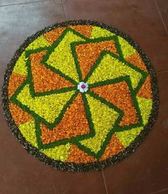 a circular flower arrangement on the ground