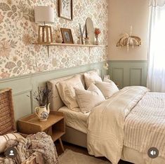 a bed room with a neatly made bed next to a night stand and two wicker baskets