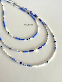 "Dainty Blue beaded necklaces with fresh water pearles and gorgeous royal blue beads in \"old money\" style.   Made with delicate high quality Czech glass seed beads. Get for yourself or gift to a friend. ♥   #vichkin #vichkindesign ↠ ABOUT    ▢  Size: about 15 inch, goes up to about 17 inch with chain extension.  ▢  Materials: 2mm / 3mm quality Czech glass seed beads  ▢  This item is handmade and may vary slightly from the picture, making every one completely unique.  ▢  Ready to ship. ↠ IMPORTANT The product is not suitable for young children. Please exercise child  Please check out my Jewelry Collection here: https://www.etsy.com/ca/shop/Vichkin?ref=seller-platform-mcnav§ion_id=22731346 Back to main page https://www.etsy.com/ca/shop/Vichkin All my items are handmade with love ♥  Natalie Summer Seed Bead Necklace, Boho Ocean, Beaded Chocker, Coastal Granddaughter, Blue Beaded Necklace, Old Money Style, Blue Beach, Summer Necklace, Fancy Jewelry