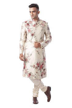 Beige sherwani highlighted with thread-jaal embroidery, concealed placket, band collar and full sleeves. Comes with light beige kurta and churidar.
Component: 3
Embroidered
Neckline: Band Collar
Sleeve Length: Full
Fabric: Cotton Silk, Dupion Silk
Color: White - Aza Fashions Reception Sherwani With Floral Embroidery, Designer Sherwani With Floral Embroidery, Floral Embroidered Sherwani For Reception During Eid, Designer Floral Embroidered Kurta For Reception, Designer Sherwani With Floral Embroidery For Eid, Designer Sherwani With Floral Embroidery For Diwali, Designer Cream Sherwani With Floral Embroidery, Designer Floral Embroidered Sherwani For Diwali, Festive Designer Sherwani With Floral Embroidery