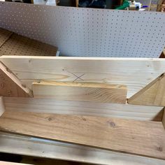 a wooden bench being built in a workshop