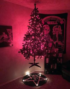 a christmas tree with pink lights in a room