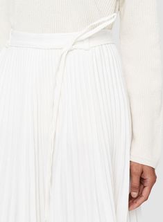 ***FINAL SALE*** The Striped Linen Cotton Siddons Skirt in Ivory by Joseph is a midi length, A-line skirt crafted in a cotton and linen blend with a fitted waistband and removable self-tie belt. 66% Linen, 32% Cotton, 2% Elastane Concealed side zip fastening