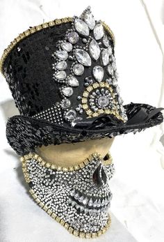 This is limited edition 2 pcs set Top hat and half face mask by SteamEra Production Hand made Black sequences burlesque look Top Hat with hand stitched jewels details at front with black and white stones at the base of hat ribbon.Mask has 2 adjustable straps, it has a 4 buckles and can be tightened to adjust to most heads and inside is fully lined and has sponges for comfortable fit. please refer to photos.This is hand made and it is very well made.This hat is made of black sequences Fabric and High Crown Top Hat For Carnival, Adjustable Masks And Prosthetics For Carnival Party, Black Hat For Mardi Gras Party, Sequence Fabric, Punk Ideas, Steampunk Hats, Beach 2023, Sequence Top, Black And White Hats