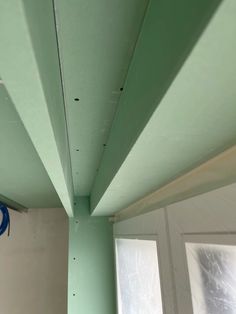 the inside of a room with green paint on the ceiling