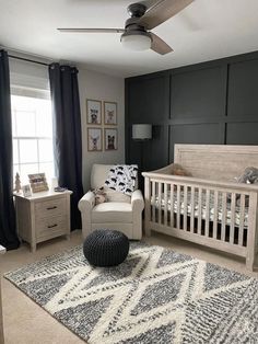 a baby's room with black and white decor