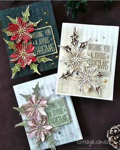 three christmas cards with poinsettis and pine cones on the top one has a card saying wishing you a joyous christmas