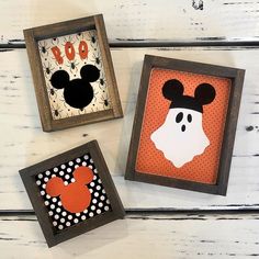 three framed mickey mouses are on display in wooden frames with polka dots and black ears