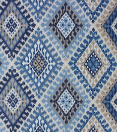 an old blue and white rug with diamond shapes