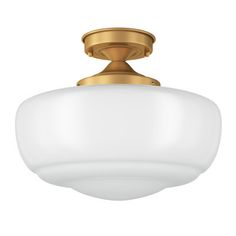 a light fixture with a white glass shade on the top and gold trimmings