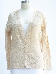 Beige Cotton Open Knit Cardigan, Cream Cotton Crochet Sweater, Beige Long Sleeve Crochet Sweater, Elegant Cream Open Knit Crochet Top, Cotton Crochet Lace Sweater For Fall, Cream Crochet Cotton Sweater, Crochet Cream Cardigan For Fall, Cream Crochet Cardigan For Fall, Fall Crochet Cream Cardigan