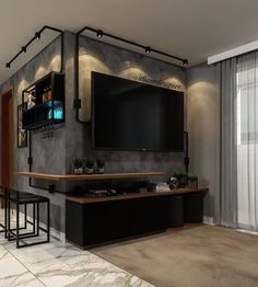 a living room with a large flat screen tv mounted to the wall next to two bar stools