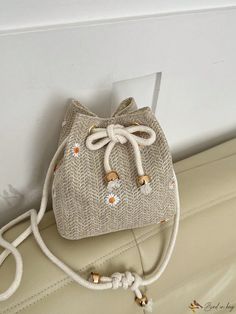 Bird in Bag - Chic Vacation Mini Straw Bag with Exquisite Floral Embroidery and Drawstring Closure Embroidered Beige Bucket Bag, Beige Embroidered Bucket Bag, Beige Floral Embroidered Bag For Summer, Embroidered Cream Shoulder Bag For Summer, Mini Shoulder Bag, Bag Bag, Bird In Bag, Color Khaki, Floral Embroidery