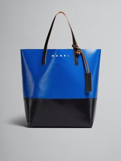 North/South open tote bag. Leather handles and tag with embossed Marni logo. Printed Marni logo. Everyday Bucket Bag With Logo, Everyday Bucket Bags With Logo, Everyday Use Bucket Bags With Logo, Blue Rectangular Bag With Logo, Everyday Blue Bags With Logo, Elegant Blue Bag With Logo, Elegant Blue Bags With Logo, Modern Bags With Logo In Coated Canvas, Blue Leather Bags With Logo