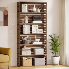 a room with a chair, bookshelf and plants