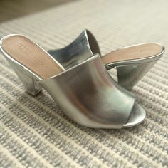 Brand New! 3.75” Heel. Runs A Bit Big. I Wear An 8-8.5 And Fits. Silver Open Toe Casual Heels, Casual Silver Open Toe Heels, Chic Silver Heels For Spring, Glamorous Slip-on Heels For Spring, Glamorous Spring Slip-on Heels, Spring Silver Heels With 4-inch Heel, Trendy Silver Heels For Spring, Silver Mules With Padded Heel For Spring, Silver Mules For Spring Party