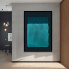 a painting hanging on the wall in a room