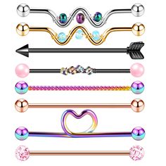 an assortment of different types of piercings on a white background with hearts and arrows