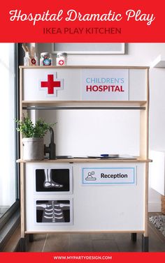 a hospital play kitchen with the words hospital dramatic play in red and white on it