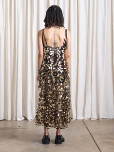 Extremely full skirt dress in unique sheer floral sequin fabric. adjustable spaghetti string straps. unlined.    content & care:  100% polyester    dry clean Overalls And Sweater, Layering Jacket, Golden Dress, Full Skirt Dress, How To Make Clothes, Linen Skirt, Sequin Fabric, Mid Dresses, Indie Design