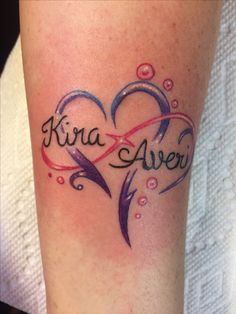 a tattoo with two hearts and the word kira aver on it's arm