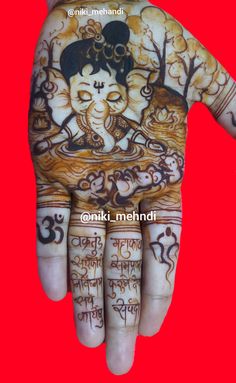 a person's hand painted with hendi designs