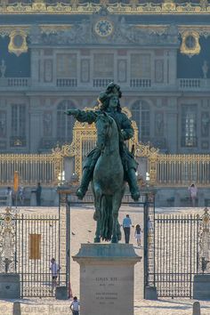 a statue of a man riding on the back of a horse