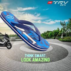 a pair of blue flip flops sitting on top of a brick floor next to a scooter