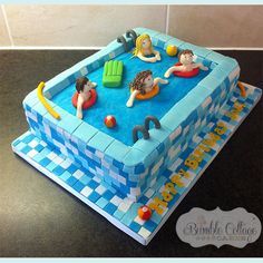 a cake that is shaped like a swimming pool with people in the water on it