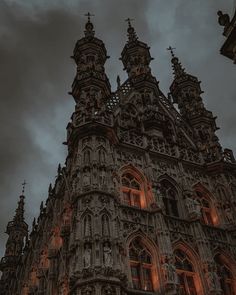 an ornate building with many windows lit up at night